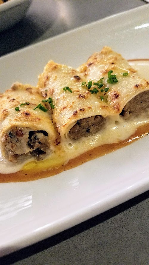 Can Font Happy Hour, also available on their starters section of the dinner menu, of Canelons Trufats - Stuffed Canelons, Chicken, Beef,Pork, Foie Gras, Black Truffle-Parmesan & Ementhal Cheese