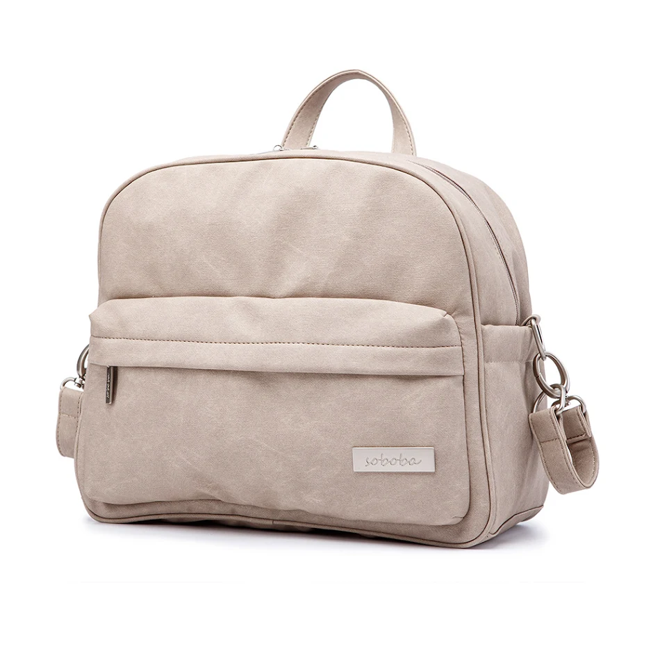 Sac à dos pour poussette bébé couleur unie, sac à langer maman. Grand espace de rangement, organisation optimale pour couches et accessoires.