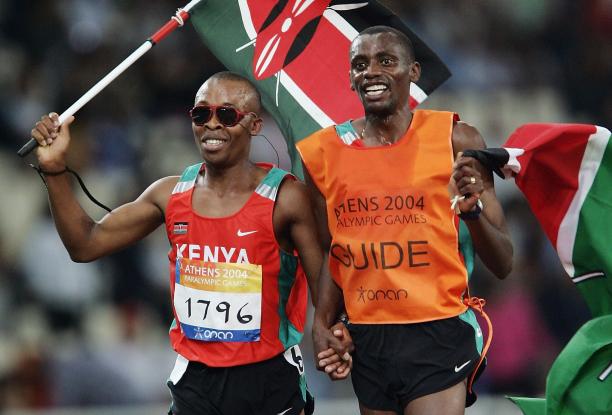 Henry Wanyoike and his guide Joseph Kibunja during the 2004 Athens Paralympics Games