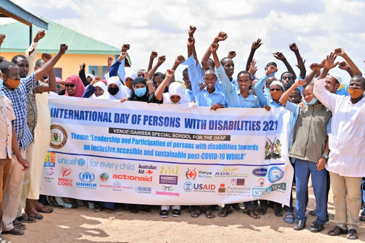 Pupils of the Garissa Special School for the Deaf and other officials during the International Day for People Living with Disabilities.