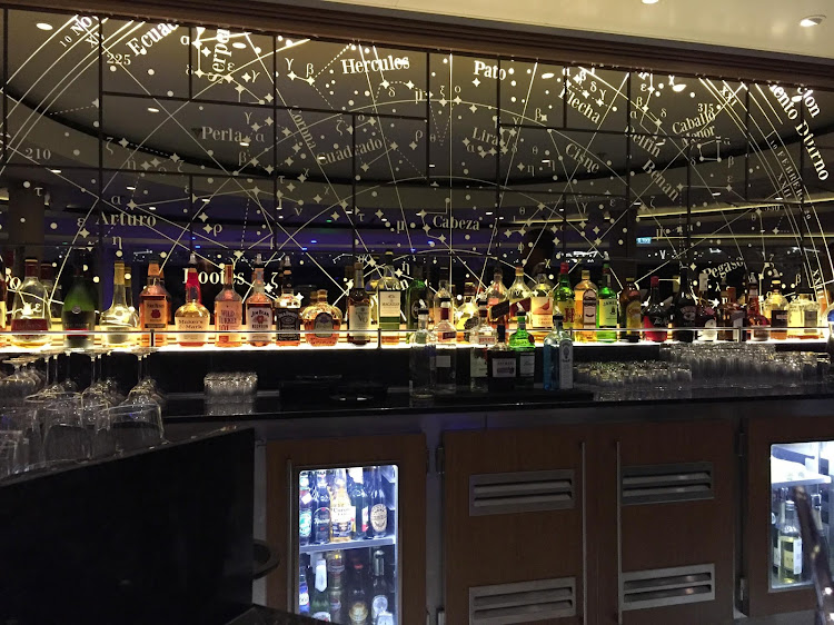The pretty bar in the Explorers' Lounge observation deck on your Viking Ocean ship.