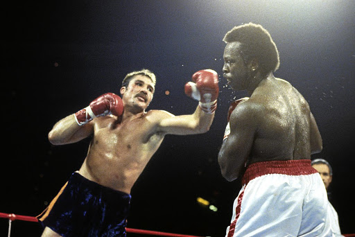 Gerrie Coetzee hooks Michael Dokes during their fight in Ohio, US. Coetzee stunned the Americans to win the WBA World heavyweight title. The SA legend had 21 KOs in 33 wins against six losses and a draw.