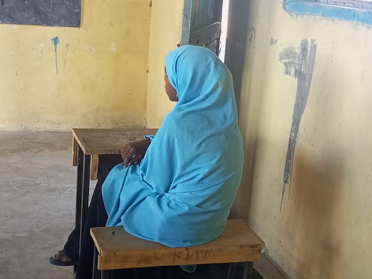 A girl in school at Lago Primary, Garissa county. Most pupils have dropped out of school in search for water and pasture for their goats as the drought continues to wreak havok in the country