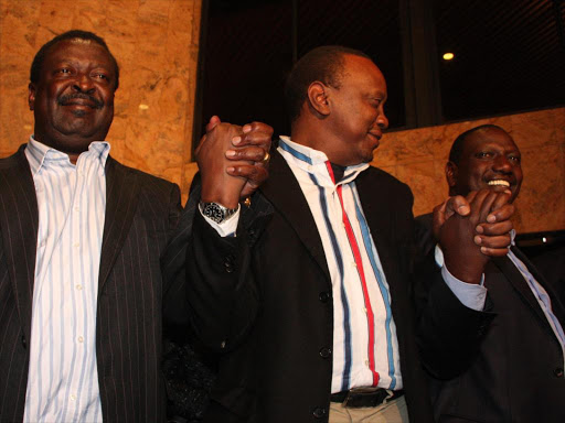 Amani leader Musalia Mudavadi with President Uhuru Kenyatta and Deputy President William Ruto at when they signed an MoU at Laico Regency in the run up to the 2013 general elections on December 6, 2012. /CHRISPINUS WEKESA