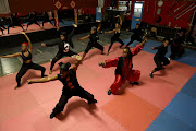 Master Dlamini trains his female class on how to protect themselves against gender-based violence at Black Fox Martial Arts.