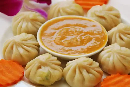 Steamed Veggie Nirvana Momo With Butter Garlic Sauce