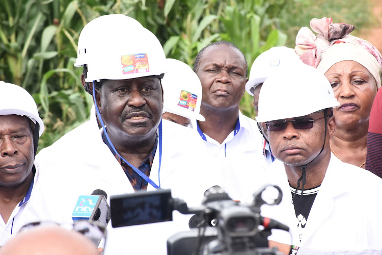 Opposition leader Raila Odinga (C) addresses the media alongside Kilifi Governor Amason Kingi when they toured Galana-Kulalu irrigation project in Kilifi county on August 29