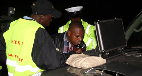 A Kenyan uses the gadget on a road.