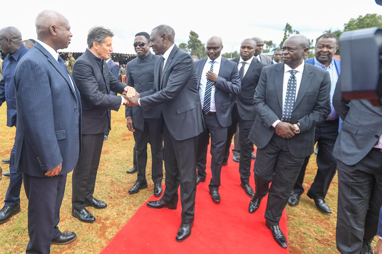 President William Ruto greets World athletics boss Sebatian Coe escorted by Sports CS Ababu Namwamba, his Deputy Rigathi Gachagua, Elgeyo Marakwet Governor Wisley Korir and other dignitaries at Kelvin Kiptum's burial in Chepkorio on February 23, 2024