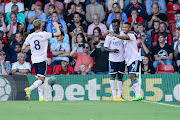 Gabriel Jesus of Arsenal celebrates with team-mates Martin Ødegaard and Bukayo Saka before his goal is ruled offside following a VAR check during the Premier League match between AFC Bournemouth and Arsenal FC at Vitality Stadium on August 20, 2022 in Bournemouth, England.