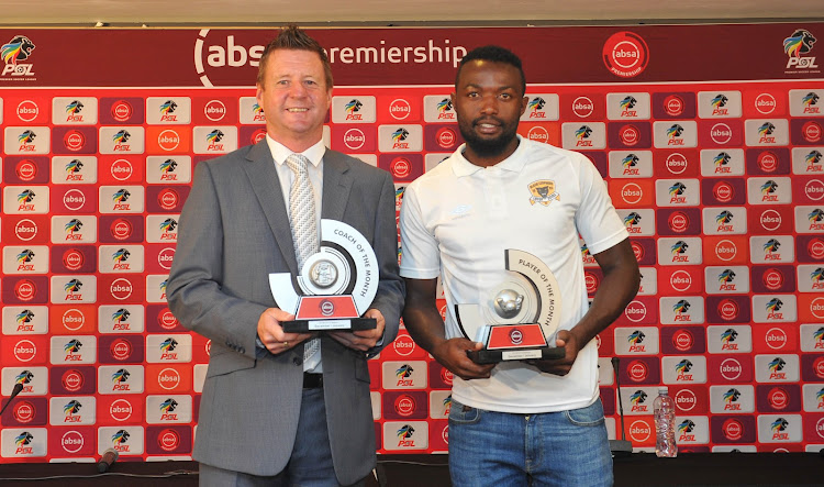 Black Leopards head coach Dylan Kerr (L) and his Zambian striker Mwape Musonda receive their awards at the PSL headquarters in Parktown in the north of Johannesburg.