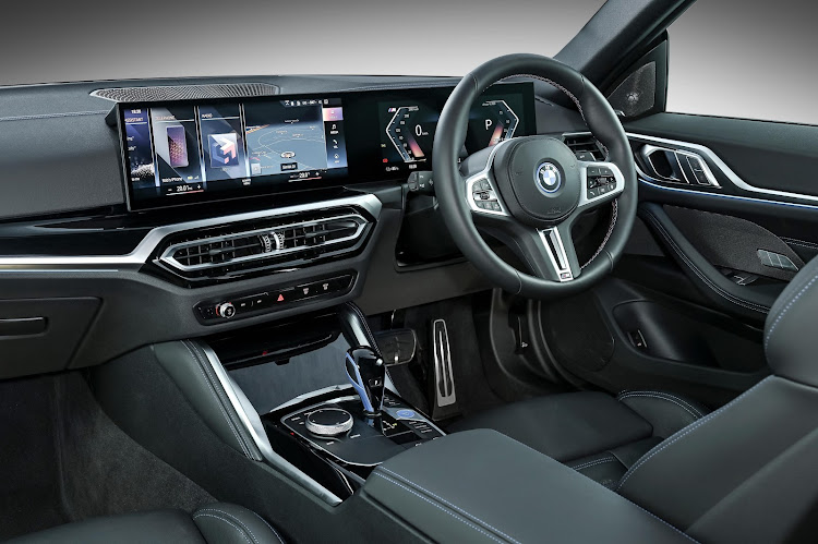 The i4 has a curved 14.9-inch display touchscreen powered by the new BMW Operating System 8 and a 12.3-inch instrument panel. Picture: SUPPLIED