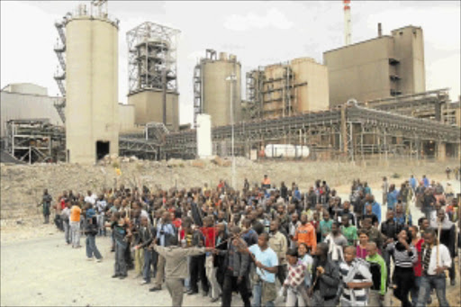 UNITED CALL: Disgruntled Marikana mineworkers protest to demand a salary increase. PHOTO: ANTONIO MUCHAVE