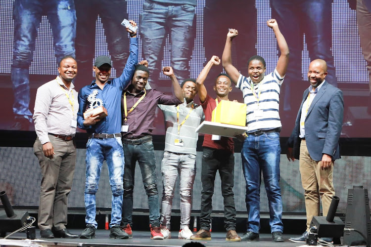 Celebrating with app developer Lesego Finger, second from left, after his win are, from left, Fundi CEO Tshepo Ditshego, Xolani Methula, Mthokozisi Nzolo, Tafadzwa Muzerengani, Thokozani Xaba and MTN GM: enterprise sales, Magatho Mello.