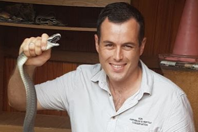 Snake removal expert Nick Evans with a black mamba he rescued in Durban. File photo.