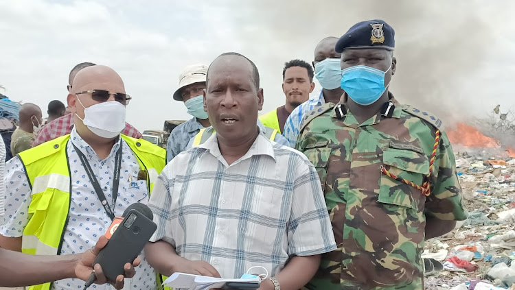 Garissa assistant county commissioner 1 John Marete addressing the media after the destruction.