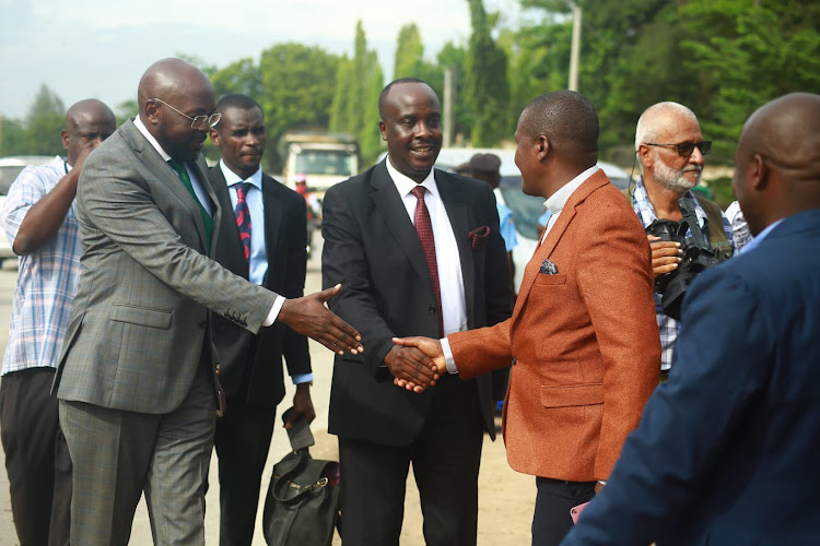 Lawyers Cliff Ombeta, Shadrack Wambui. and Danstan Omari arrive at the Shanzu Law Courts.