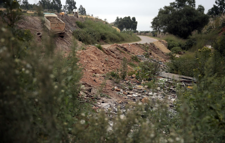 The dumpsite (with the Marathon squatter camp in the background) in Primrose, Germiston, where the boy's body was found.