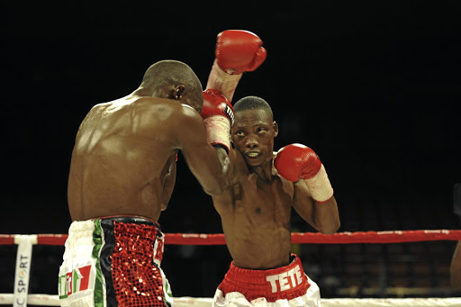 Zolani Tete, right, lashes out at Moruti Mthalane with a right during a previous fight. Tete will face Siboniso Gonya in Ireland tomorrow.