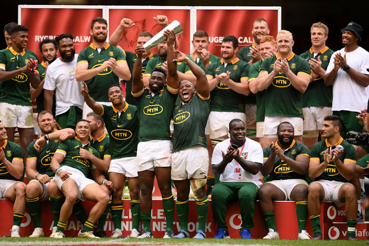 Springbok captain Siya Kolisi and hooker Bongi Mbonambi lift the Prince William Trophy with teammates after they defeated Wales at the Principality Stadium in Cardiff, Wales, on August 19 2023.