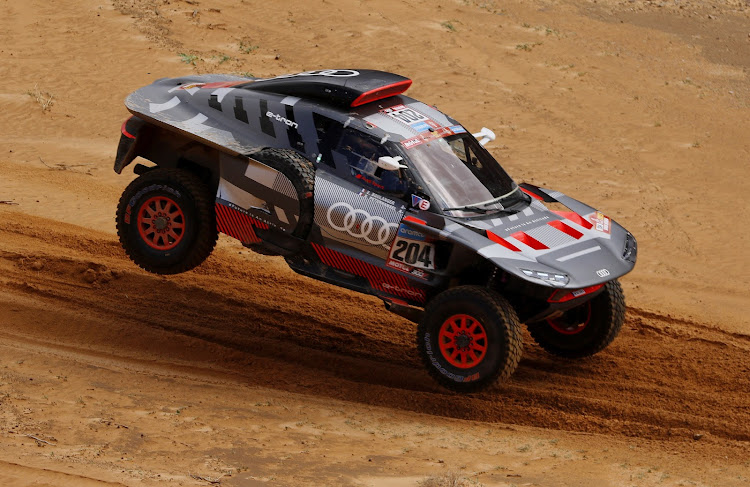 Dakar veteran Stephane Peterhansel set the pace on Friday before crashing out.