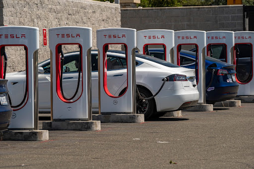 Tesla vehicles at charging stations outside a store in Rocklin, California, the US.