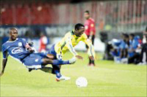 GOTCHA: United's Siboniso Gaxa fells Sundowns' Lerato Chabangu in thier PSL match at Loftus on Saturday. Sundowns won 2-0. Pic. Antonio Muchave. 01/04/07. © Sowetan.