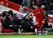 Luis Diaz of Liverpool is congratulated by the bench after being substituted during the Premier League match against Leicester City at Anfield  in Liverpool on February 10 2022.