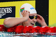 Lara van Niekerk celebrates after winning gold in the women's 50m breaststroke in Birmingham. 