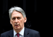 Britain's Chancellor of the Exchequer Philip Hammond is seen outside Downing Street in London, Britain, April 3, 2019. 
