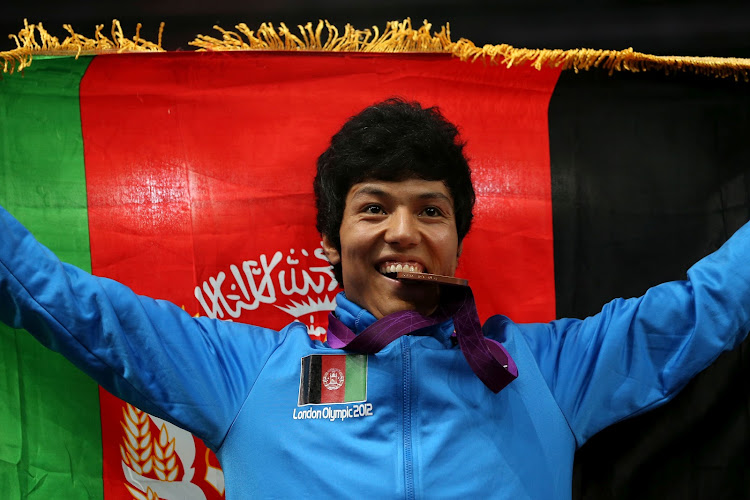 In this file picture, bronze medalist Rohullah Nikpah of Afghanistan celebrates during the podium ceremony for the Men's-68kg Taekwondo on Day 13 of the London 2012 Olympic Games at ExCeL on August 9, 2012