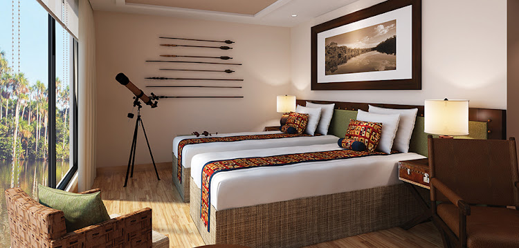 Amazon Discovery Flora Suites feature deluxe beds with fine Peruvian linens.