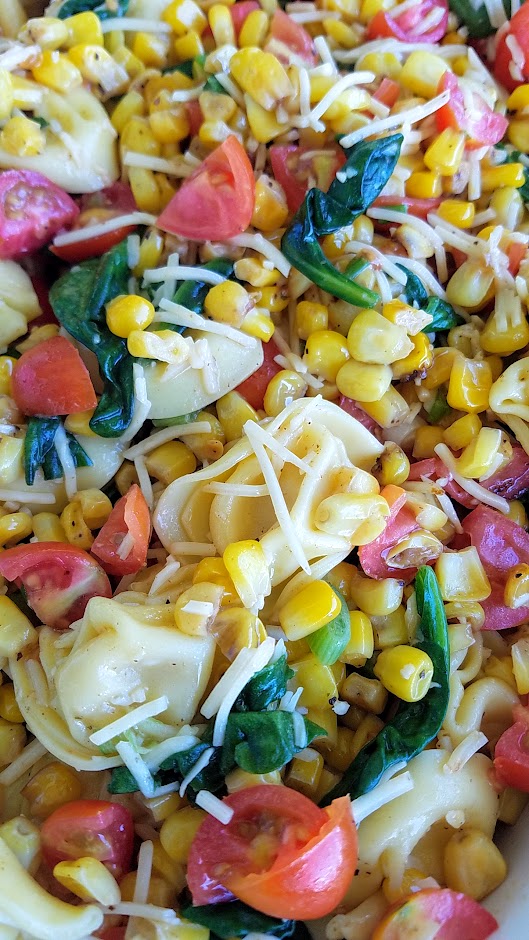 Tortellini Corn and Tomatoes Salad recipe, an easy summer recipe that takes advantage of the fresh taste of summer corn while its sweet and heirloom tomatoes at their juiciest and is perfect for a picnic, potluck, and can be served cold or room temperature