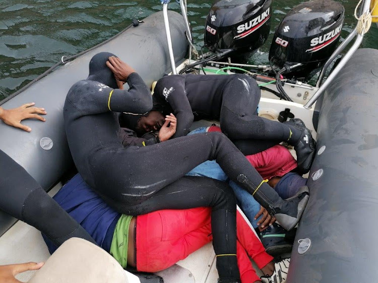 Some of the alleged abalone poachers who were arrested during a joint operation in February.