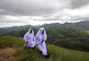 Maidens climb the mount Nhlangakazi for a church service. Photo: SANDILE NDLOVU