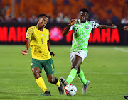 Themba Zwane (left) of South Africa and Wilfred Ndidi of Nigeria during the African Cup of Nations, Quarter Final match between Nigeria and South Africa at Cairo International Stadium on July 10, 2019 in Cairo, Egypt.