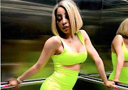 Khanyi Mbau has a yellow Porsche Carrera.