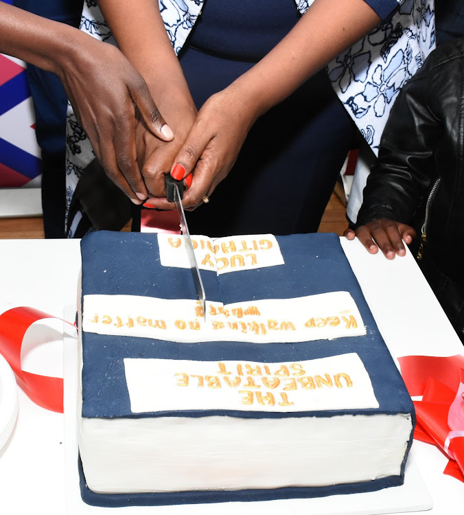 Family and Friends cut the cake to celebrate