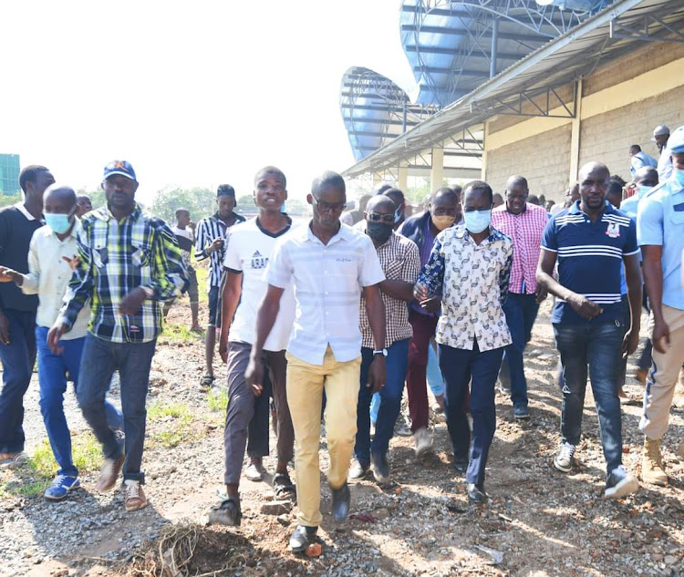 Kisumu Governor Anyang Nyong'o accompanied by Kisumu central MP Fred Outa at Kibuye market.