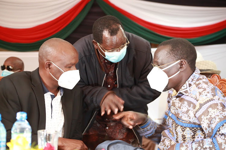 Baringo Governor Stanley Kiptis, Prof John Lonyangap’uo (West Pokot) and Josephat Nanok (Turkana) during the peace meeting at the Kenya School of Government in Kabarnet town, Baringo, on Friday.