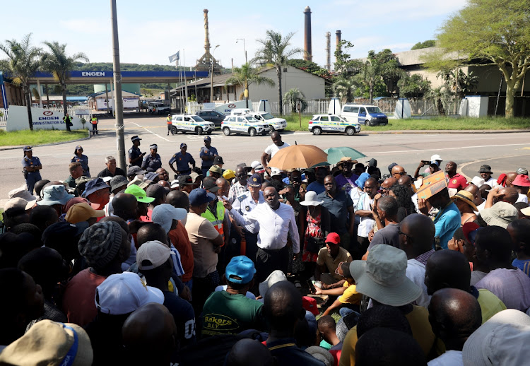 The national stakeholder engagement manager at Engen, Ronald Chauke, addressing the community of Wentworth, south of Durban, after a meeting with their leaders.