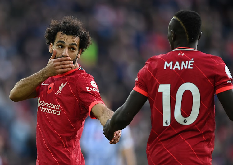 Mohamed Salah of Liverpool with teammate Sadio Mane during a Premier League match against Brighton at Anfield in October. The two will square off when Egypt meet Senegal in the 2021 Africa Cup of Nations final.