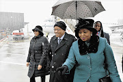 COLD COMFORT: President Jacob Zuma and wife Bongi, right, are welcomed by the South African ambassador to Switzerland Claudinah Ramosepele, left, on their arrival in Zurich. Zuma will attend the World Economic Forum in Davos with a number of cabinet ministers