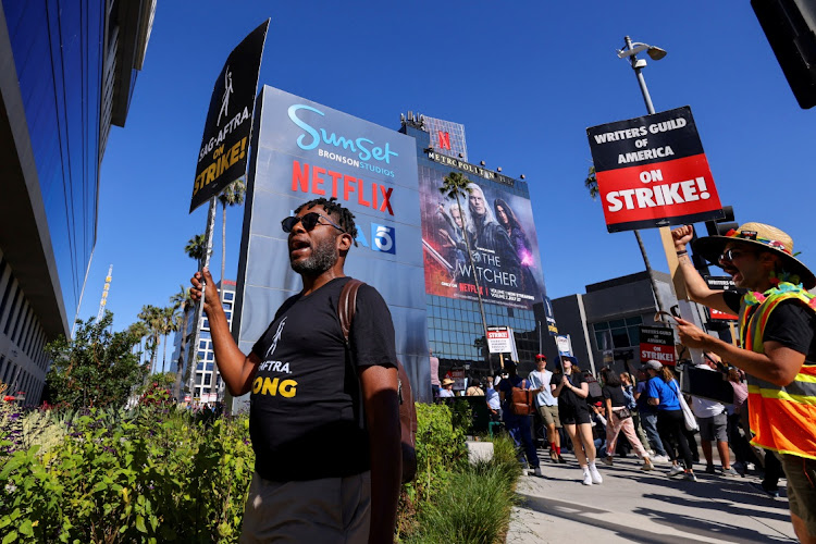 SAG-AFTRA actors strike against Hollywood studios outside Netflix’s offices in Los Angeles, California, joining the Writers Guild of America.