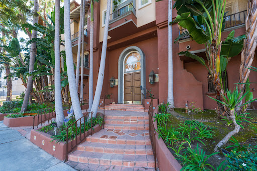 Building facade with stairs and greenery in this luxury property for sale in Los Angeles ($435,000)