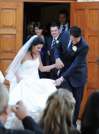 Former Proteas player Graeme Smith (R) and his new wife, Morgan Deane after the Matrimony of Graeme Smith to Morgan Deane from St Bernard's Church on August 06, 2011 in Cape Town, South Africa in this file photo. Photo by Peter Heeger / Gallo Images
