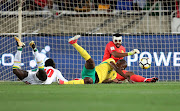 Thamsanqa Mkhize of South Africa scores own goal after shot from Sadio Mane of Senegal as Itumeleng Khune looks on during the 2018 World Cup qualifying football match between South Africa and Senegal at Peter Mokaba, Stadium, Polokwane, South Africa on 10 November 2017.