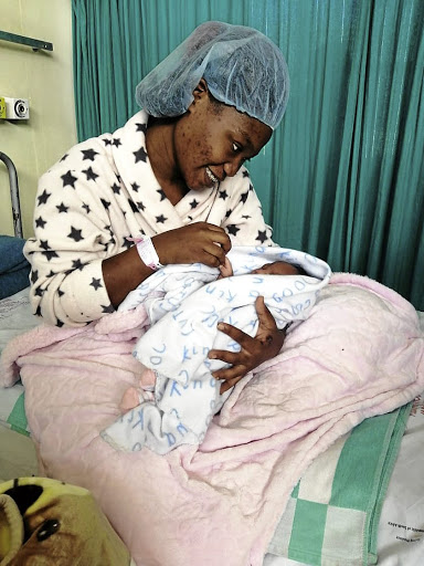 Bikokuhle Hlatshwayo at Chris Hani Baragwath Hospital with her baby Mpumelelo after she was found unharmed.