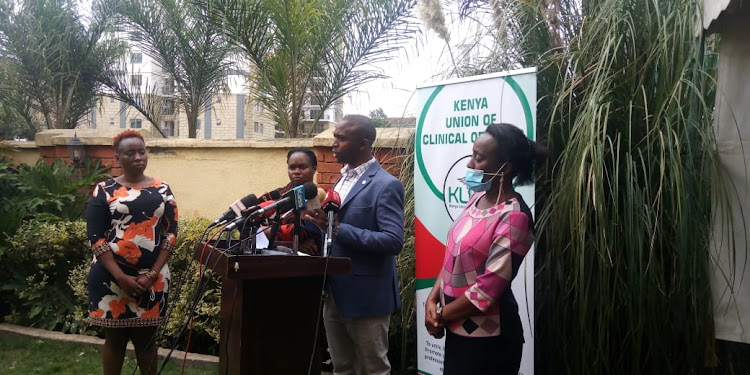 Kenya Union of Clinical officers chairperson Peterson Wachira and other union officials call off the prolonged strike at a Nairobi hotel on February 23, 2021.