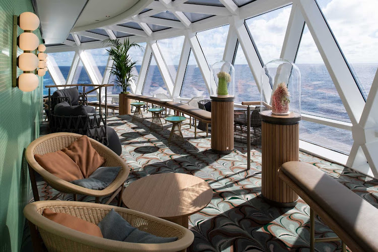  Spread out and relax in the balcony area of the huge Eden lounge aboard your Celebrity Edge class sailing.   